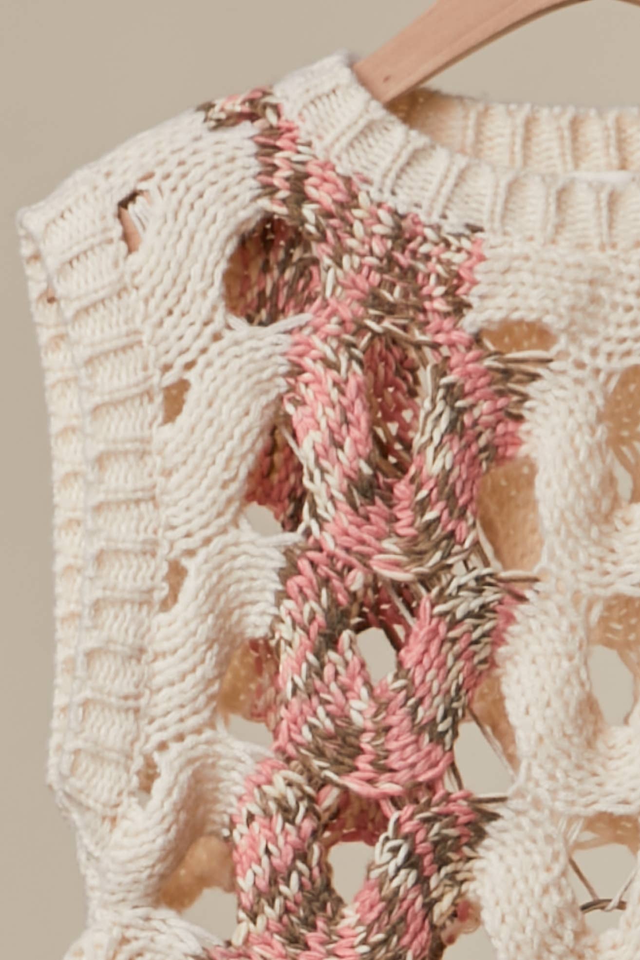 Crochet Knit Top with Floral Appliqué Detailing.