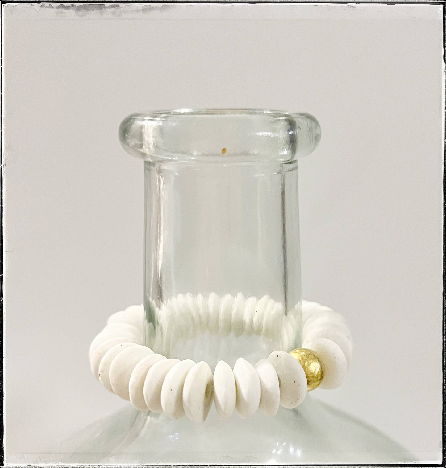 White Ashanti Glass Bead Stretch Bracelet Brass Charm Gold